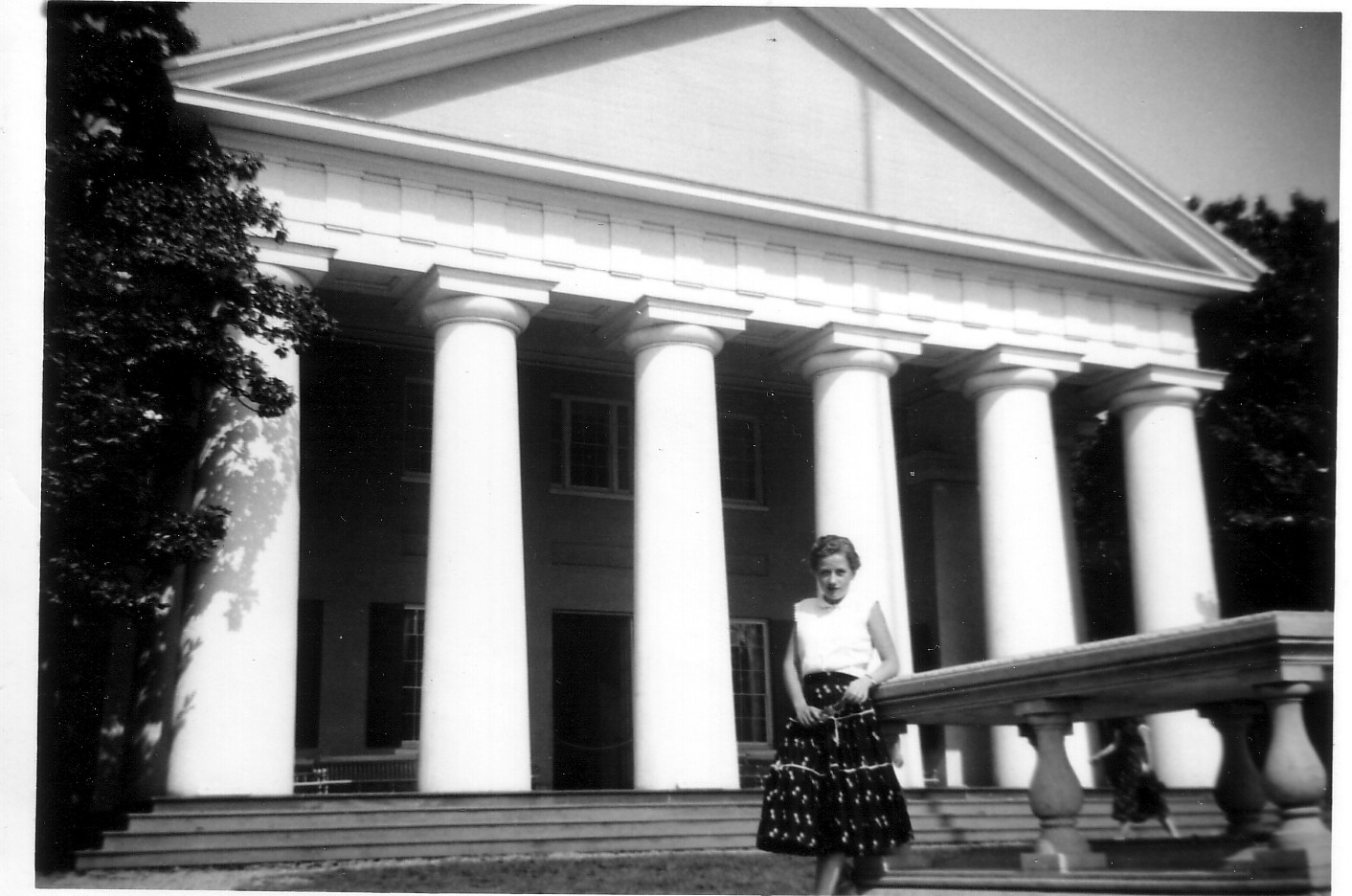 ARLENE CLENDENEN STANDING IN FRONT OF A WASHINGTON DC BUILDING.